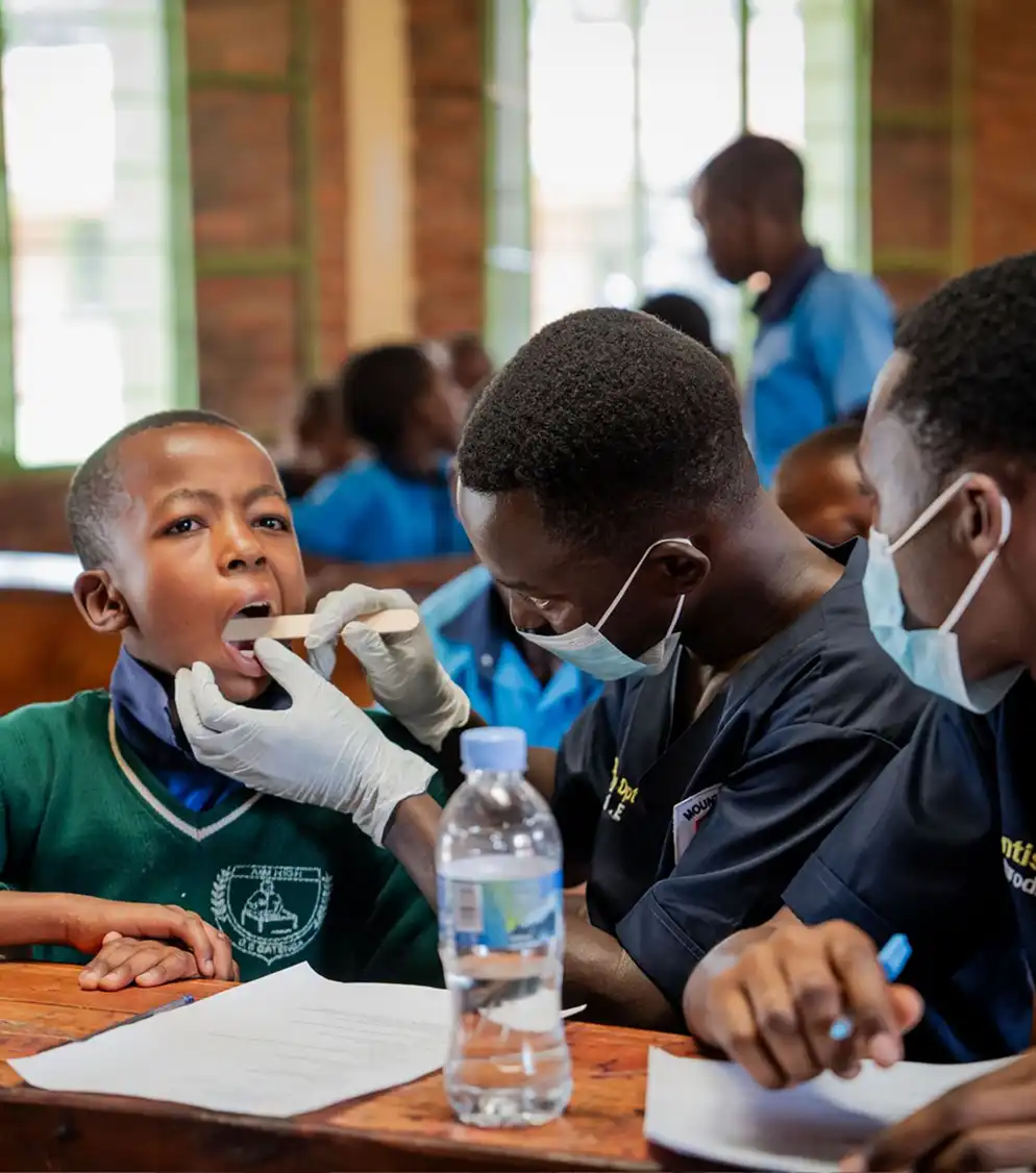 Volunteer providing dental care to a child