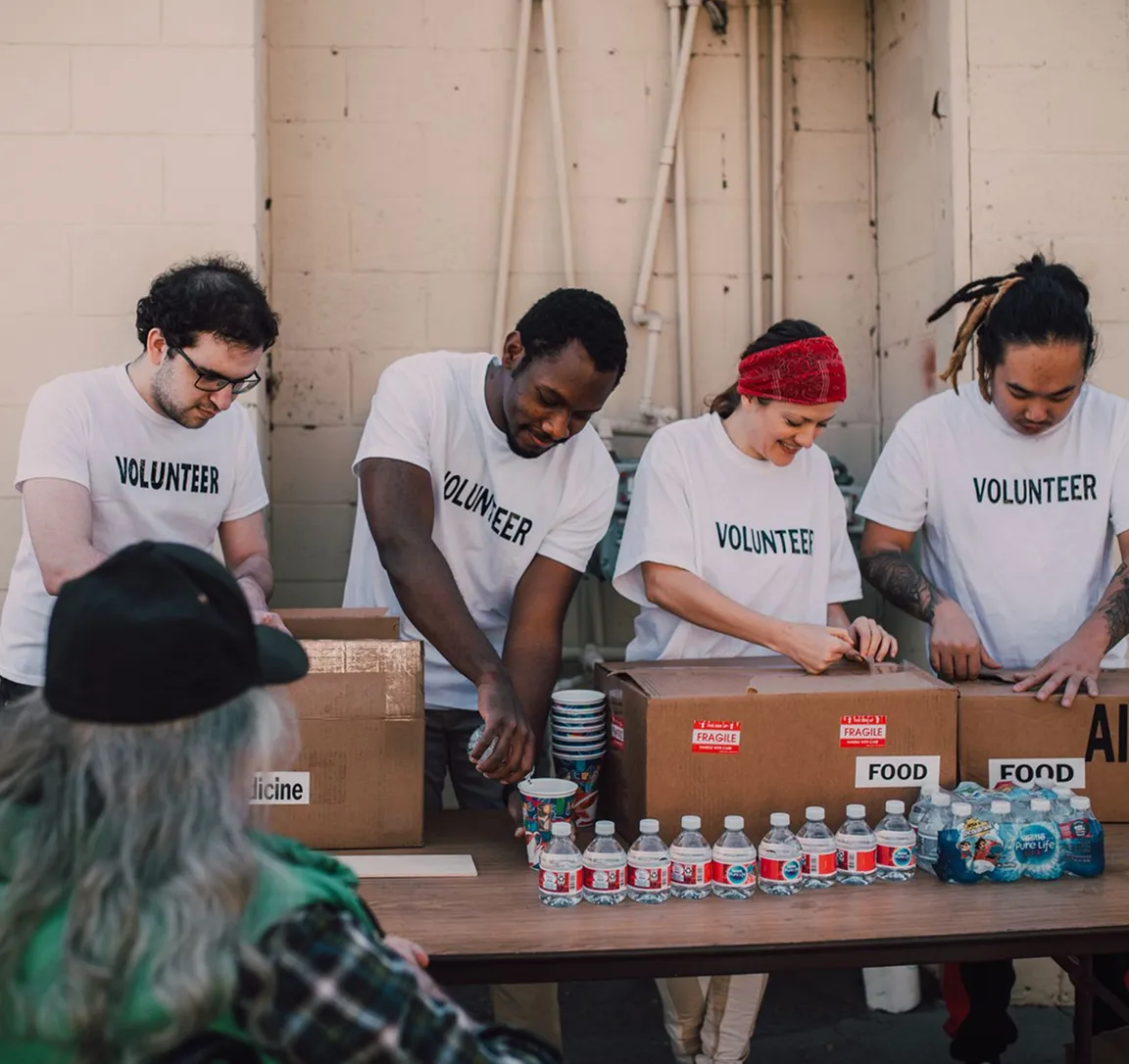 SIMPCO Foundation volunteers with medical supply boxes